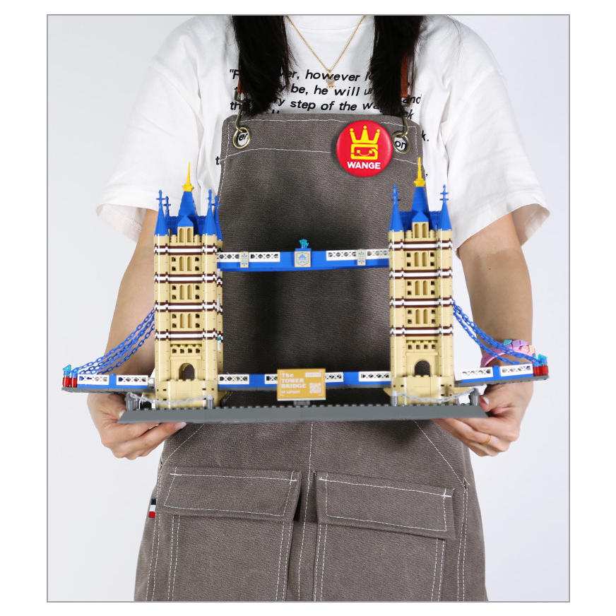Tower Bridge building blocks model with twin towers and suspension details on display base, showcasing finished build size and structure