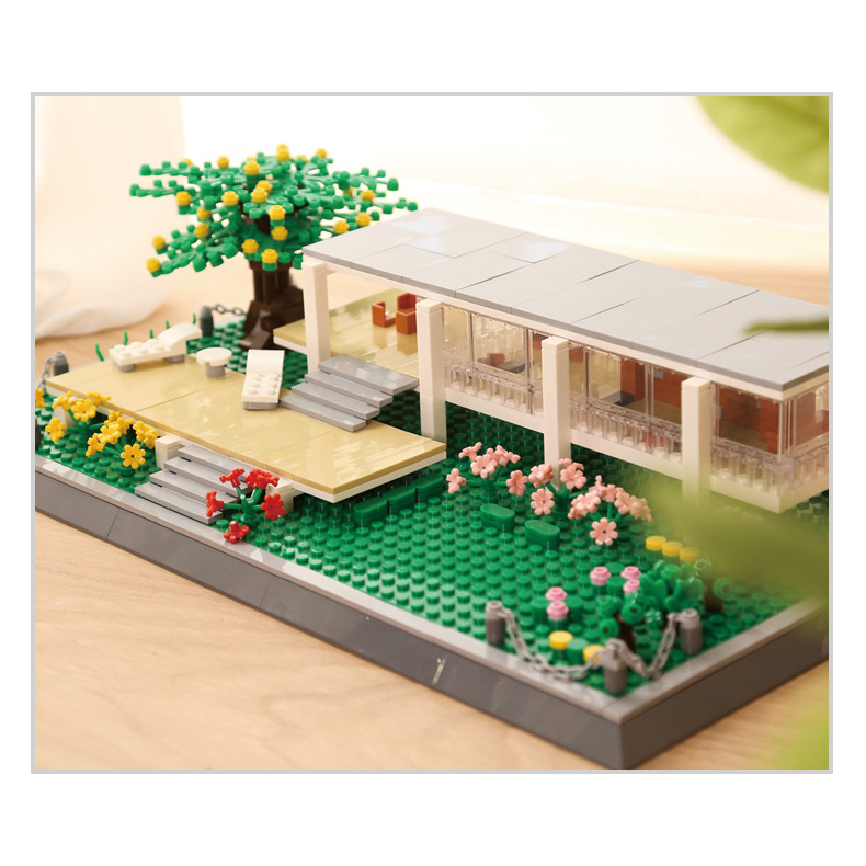 Farnsworth House building blocks model on tabletop with warm lighting, featuring modern glass structure, terrace steps, tree and landscaped garden details