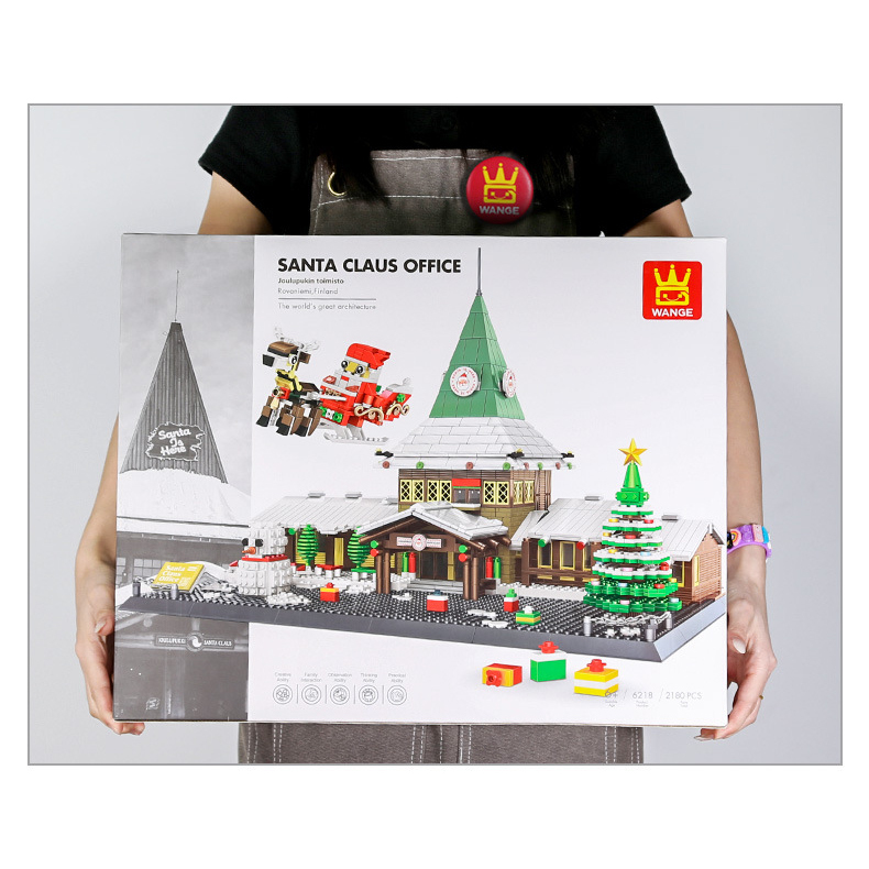 Santa Claus Office building blocks color box held for size reference, large packaging with detailed Christmas village model design