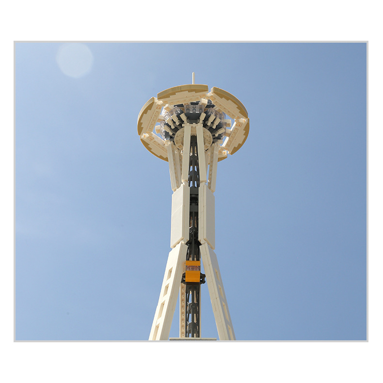 Low angle view of Space Needle building blocks model highlighting observation deck and tower structure against clear sky