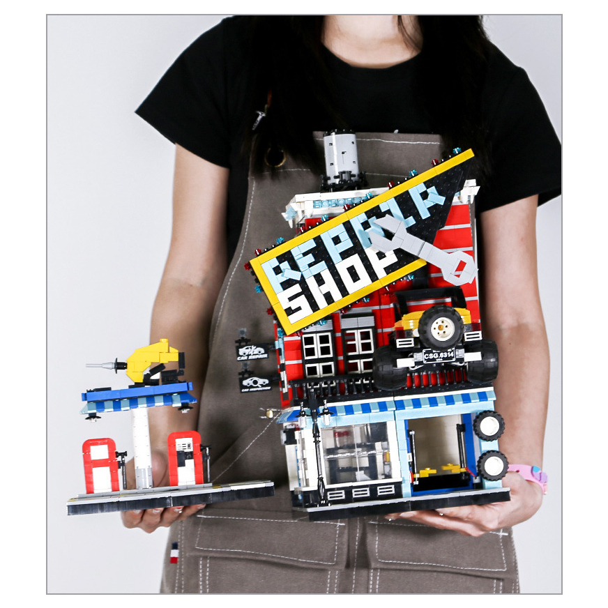 WANGE car service center building blocks model with repair shop structure, gas station detail, and vibrant street scene display