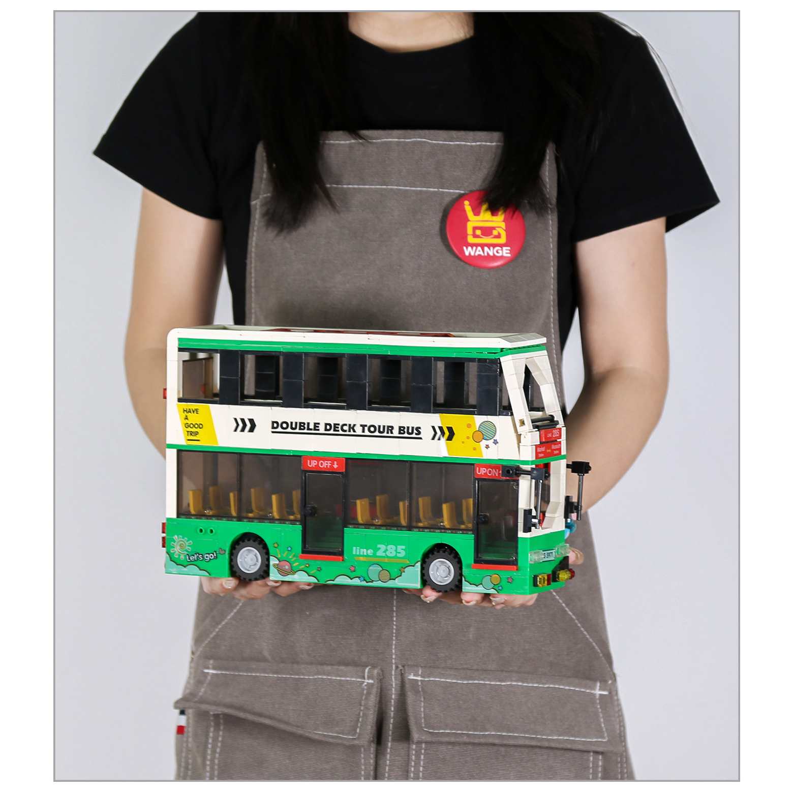Double Deck Tour Bus building blocks assembled model with open upper deck, transparent windows, and detailed interior seating in compact display size