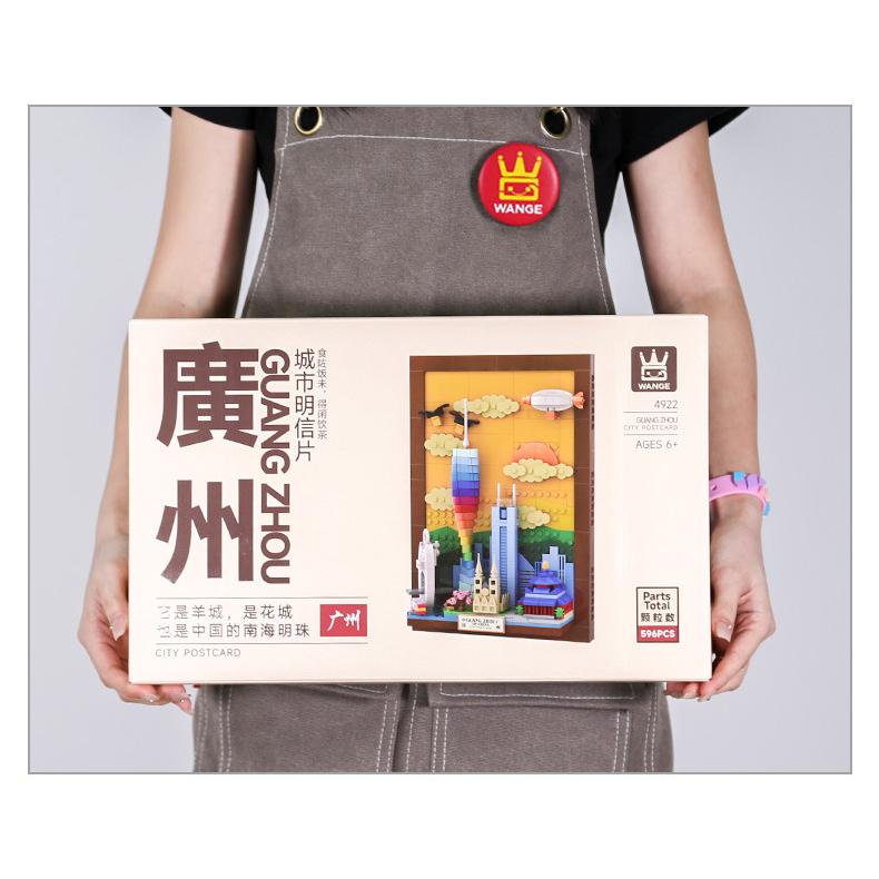 Guangzhou City Postcard building blocks box held at chest level, highlighting packaging size, front design, and clear product preview for gifting and retail display