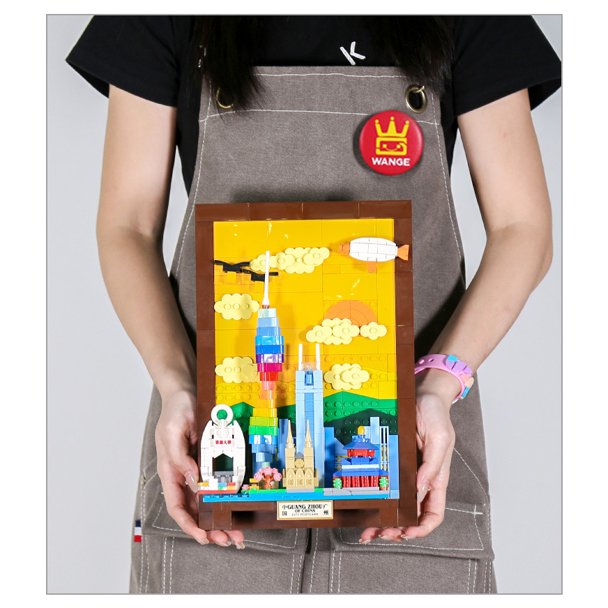 Guangzhou city postcard building blocks model held for scale, featuring colorful skyline, Canton Tower, layered clouds, and framed display design for home decor