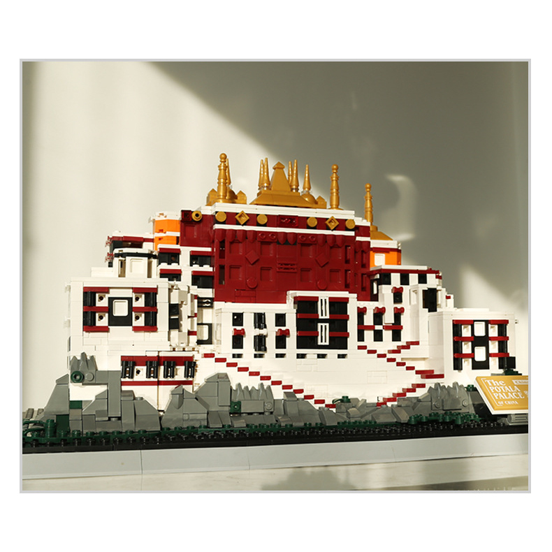 Potala Palace building blocks model displayed in warm natural lighting, showcasing layered structure, red and white facade, and golden rooftops in a cozy setting