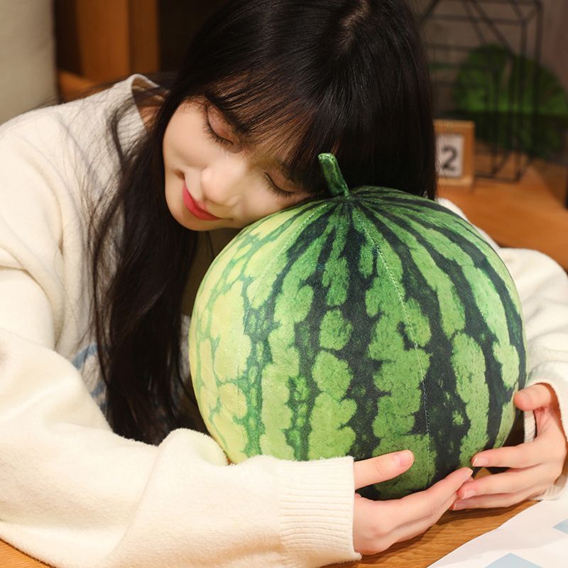 Soft round watermelon plush cushion with realistic fruit design for cuddling and relaxation