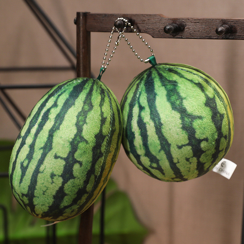 Round and rectangle watermelon plush keychains hanging as cute fruit-themed accessories