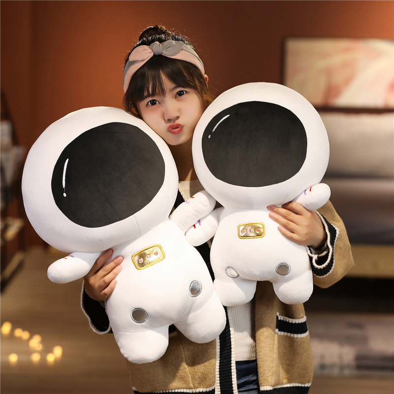 Cute astronaut plush toy with soft plush fabric and fluffy PP cotton filling, designed for cuddling and cozy room decor