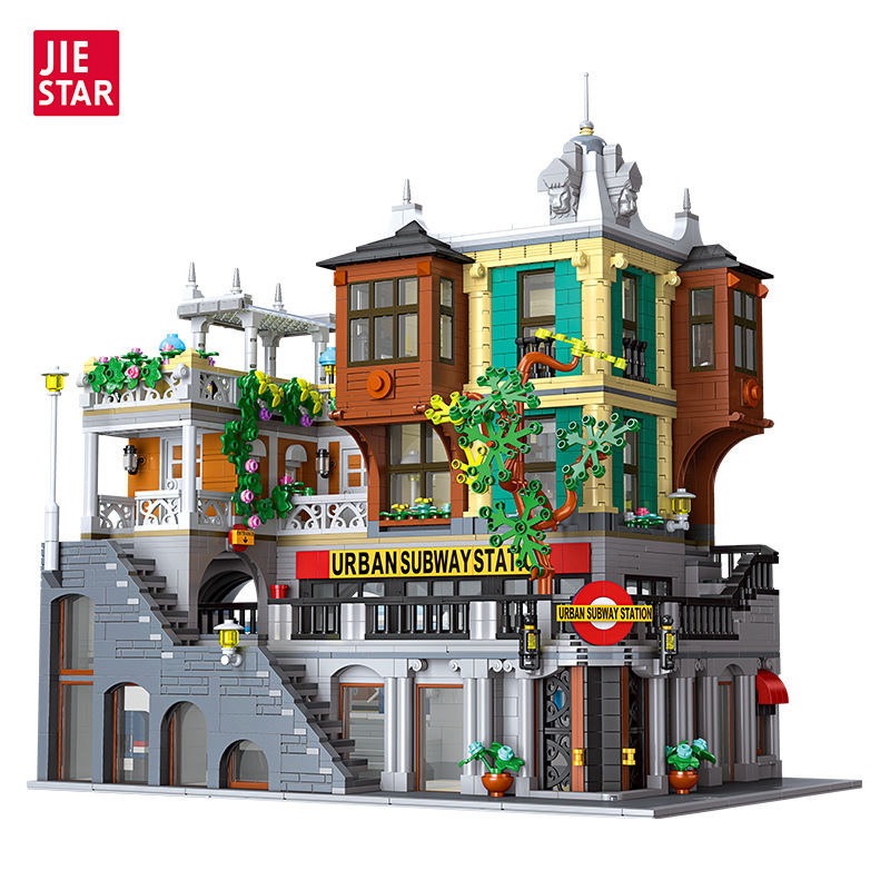 Modular city rail station building blocks display with detailed street scene architecture, elevated walkways, subway signage, windows, and urban decorative elements