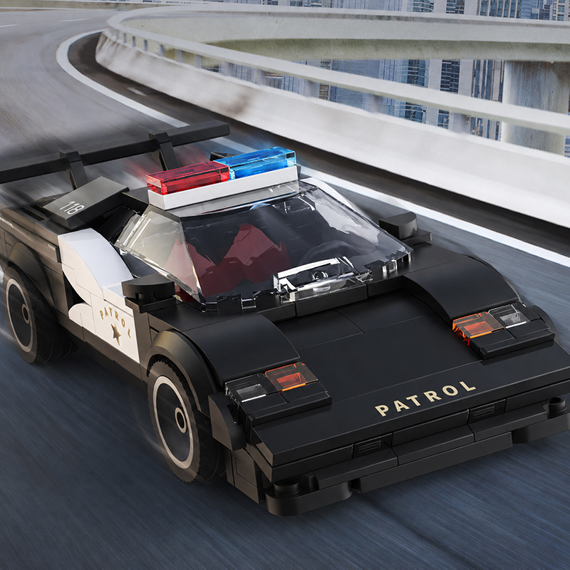 Xbert Highway Patrol building blocks police car featuring sporty vehicle styling, transparent windshield, and detailed patrol car design on an urban roadway backdrop