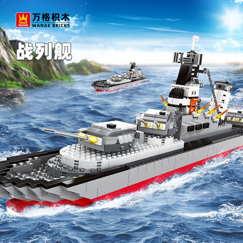 WANGE Battleship building blocks model sailing across ocean scenery with detailed naval warship design, rotating gun turret, radar tower, and military-themed display atmosphere