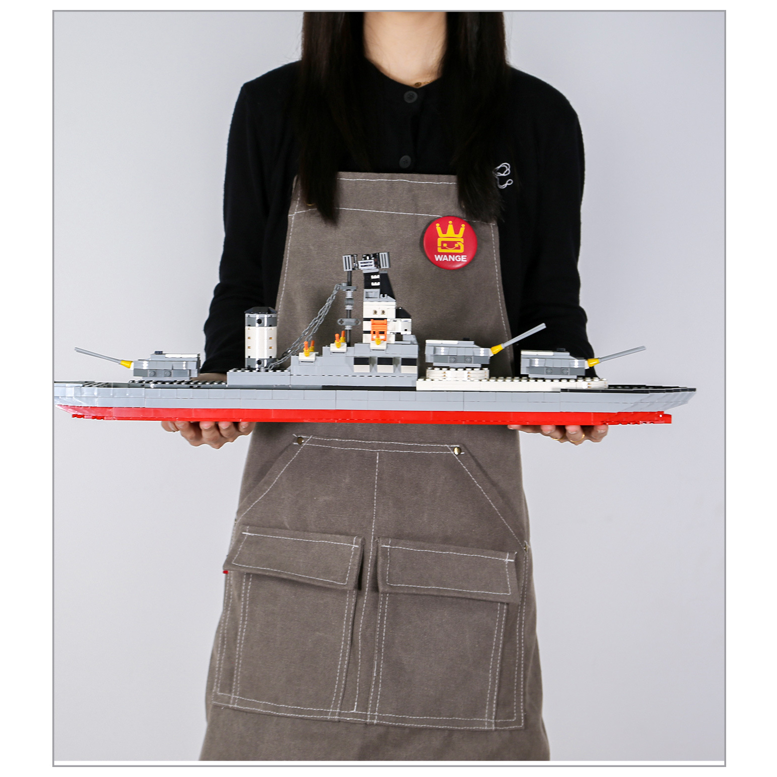 WANGE Battleship building blocks model featuring extended warship structure, rotating gun turrets, radar tower, and realistic naval styling