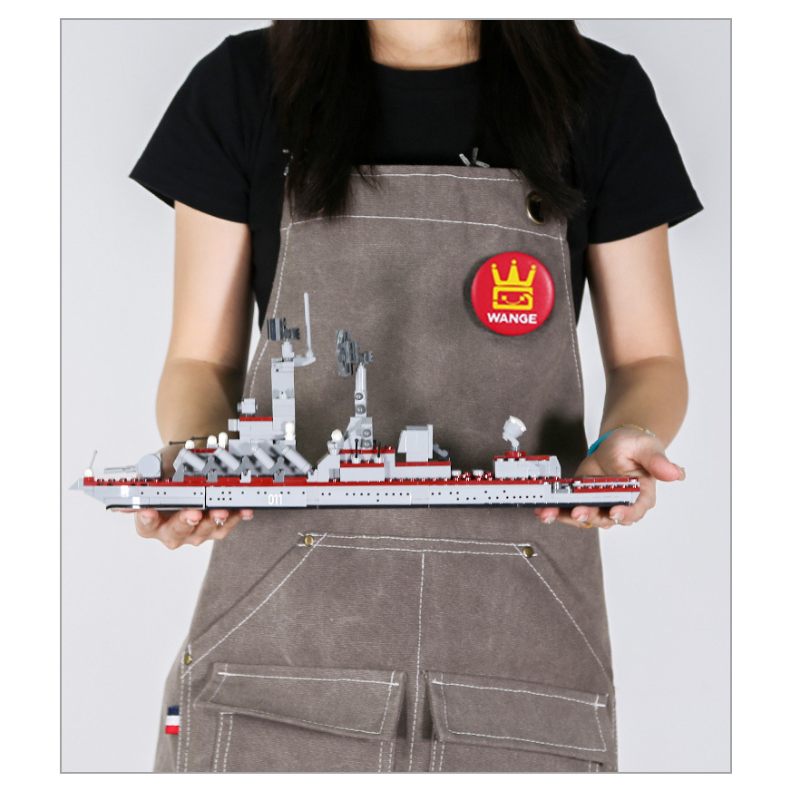 WANGE Varyag Aircraft Carrier building blocks model displayed in hand, showcasing the ship’s long hull design, radar systems, missile launch details, and display-friendly size