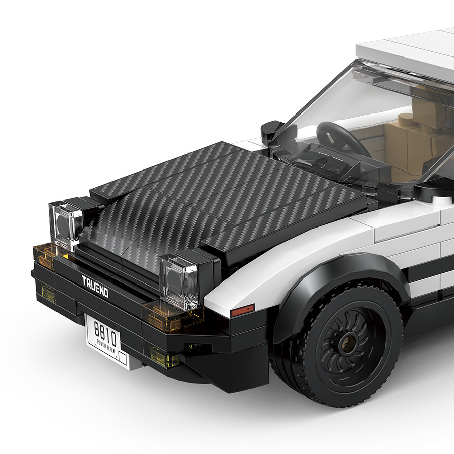 Close-up front detail of Toyota AE86 Trueno building blocks with pop-up headlights and carbon-style hood