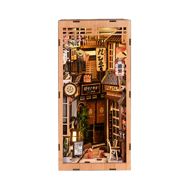 Front view of DIY The Alley Waiting for the Cat book nook featuring layered Japanese alley scenery, glowing lights, detailed shop signs, and miniature decor accents