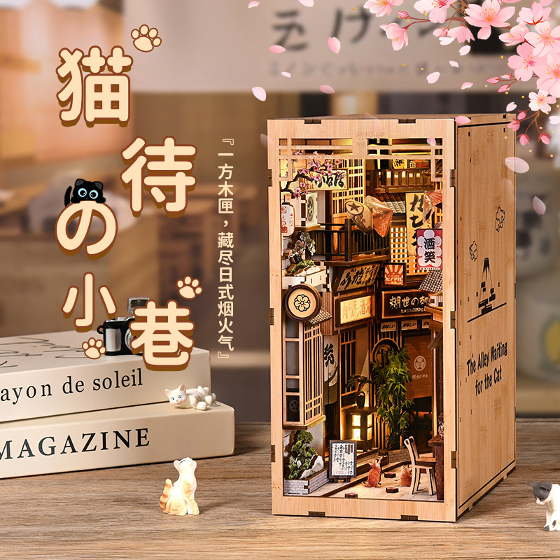 Xinyue DIY The Alley Waiting for the Cat Book Nook Kit with warm lighting, Japanese alleyway details, wooden storefronts, hanging signs, and cozy miniature decor