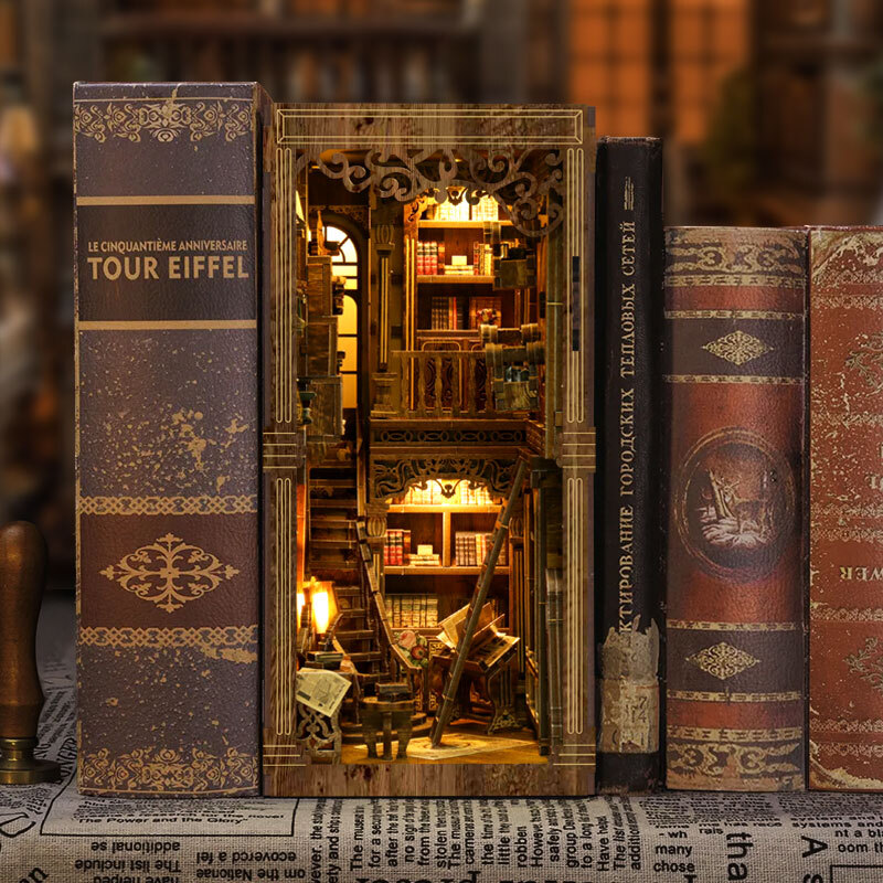 Vintage library DIY book nook displayed between classic books, featuring warm LED lighting, layered bookshelves, ladders, and intricate antique-inspired details