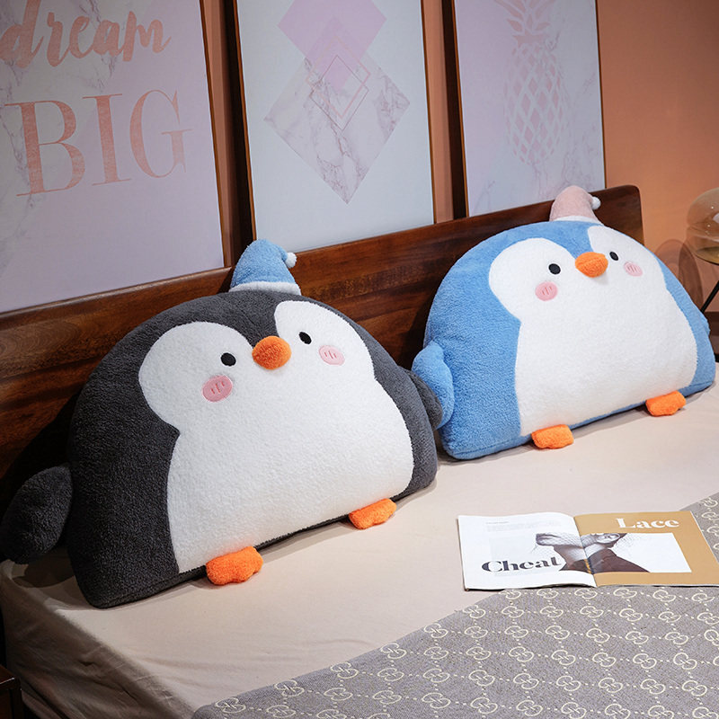 Gray and blue penguin plush backrest pillows placed on a bed for cozy bedroom decoration and relaxing support