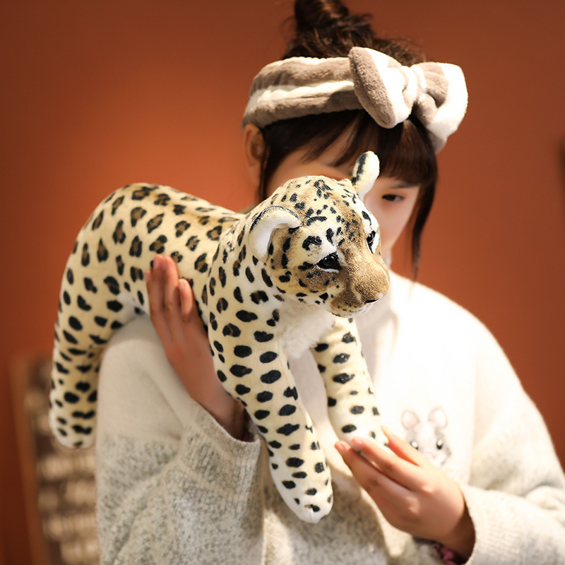 Realistic leopard plush toy featuring detailed facial embroidery, soft fur textures, and lifelike spotted patterns for wildlife-themed decor and cuddling