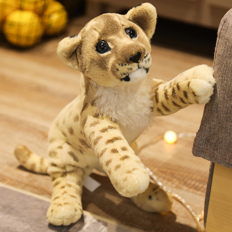 Realistic lion plush toy with detailed facial features, soft plush textures, and wildlife-inspired spotted patterns for cuddling and decorative display