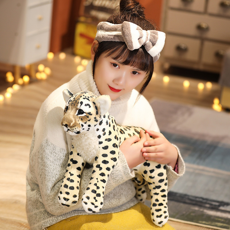 Realistic leopard plush toy with detailed spotted patterns, soft plush textures, and a cozy wildlife-inspired design for cuddling and decorative display