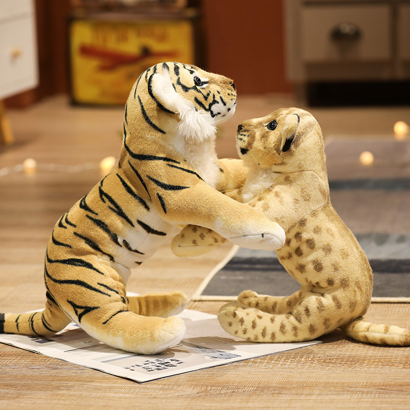 Realistic tiger and lion plush toys with detailed animal patterns, soft plush fabric, and playful wildlife-inspired poses for display and cuddling