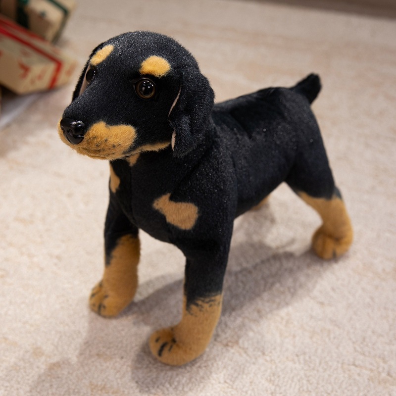 Realistic Rottweiler plush toy displayed indoors with realistic markings and soft texture