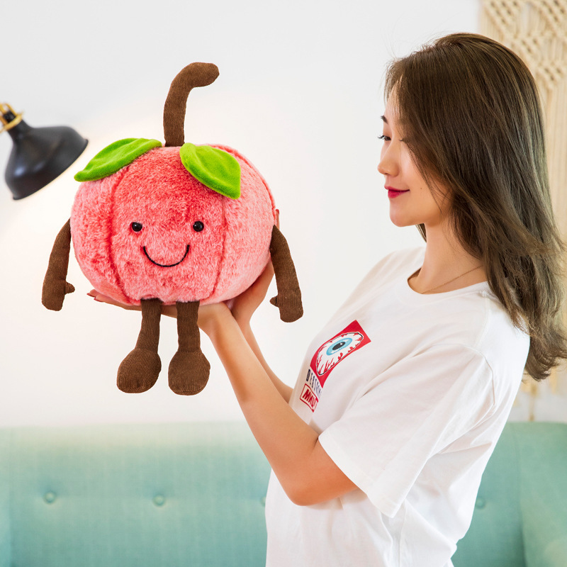 Cute smiling cherry plush toy with soft plush texture, embroidered face, and dangling limbs, highlighting its charming design and cozy companion appeal