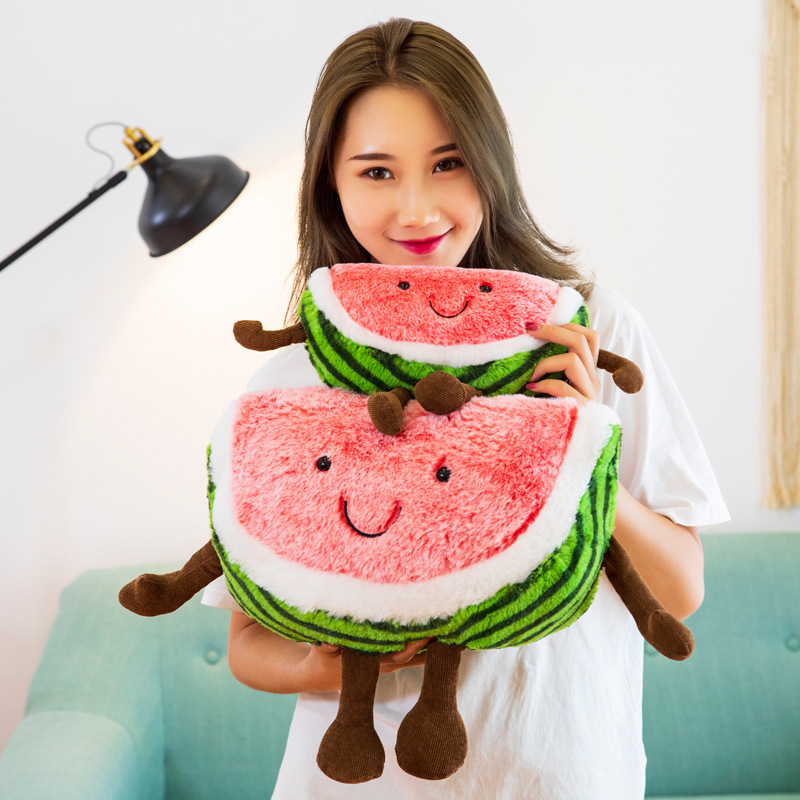 Smiling watermelon plush toys with striped rind details, soft plush fabric, and dangling arms and legs, highlighting the playful fruit design and cuddly appeal