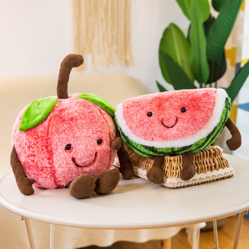 Cherry and watermelon plush toys with embroidered smiles and dangling limbs, creating a cheerful decorative accent for sofas, bedrooms, and cozy living spaces