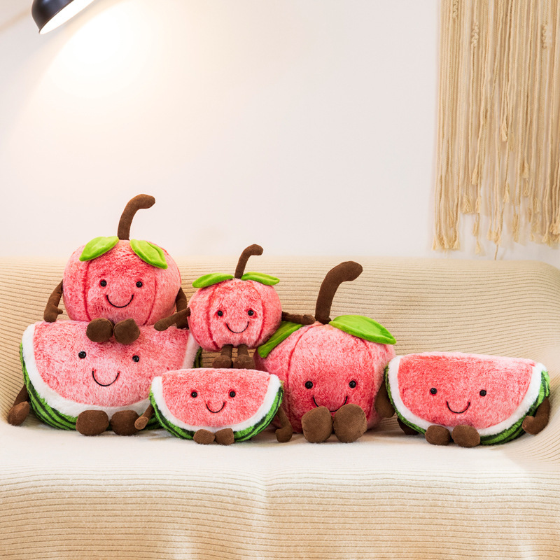 Collection of smiling cherry and watermelon plush toys in multiple sizes, highlighting the playful fruit theme and soft plush construction