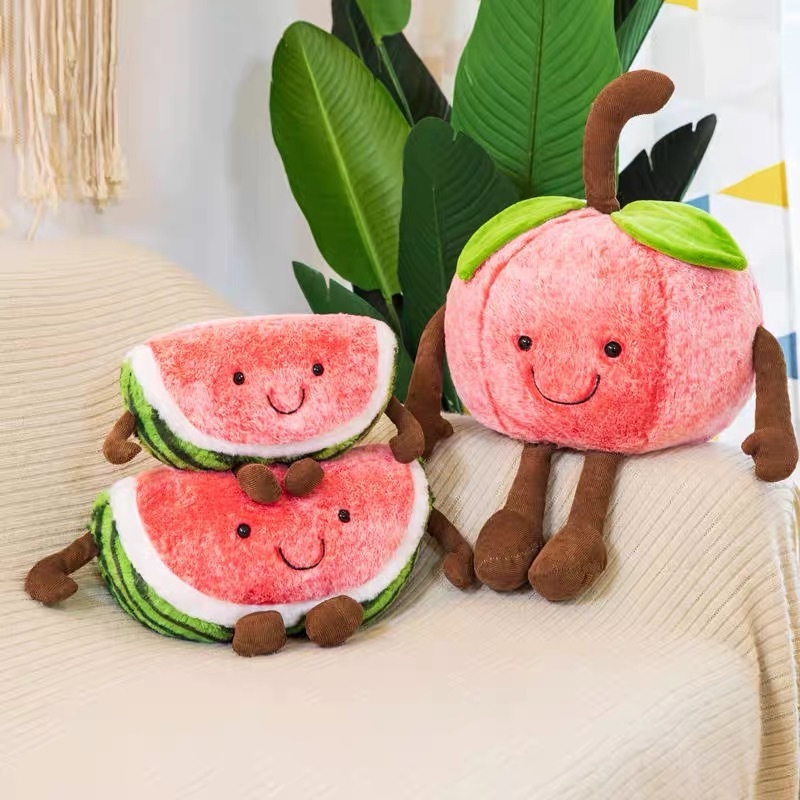 Cherry and watermelon plush toys displayed side by side, showcasing their cheerful fruit-inspired designs, soft textures, and cuddly companion appeal