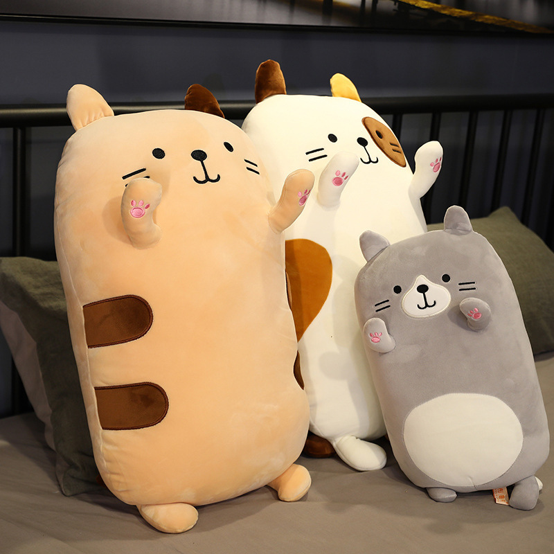 Cat Plush Pillows in Brown Cat, Calico Cat, and Gray Cat designs displayed on a bed