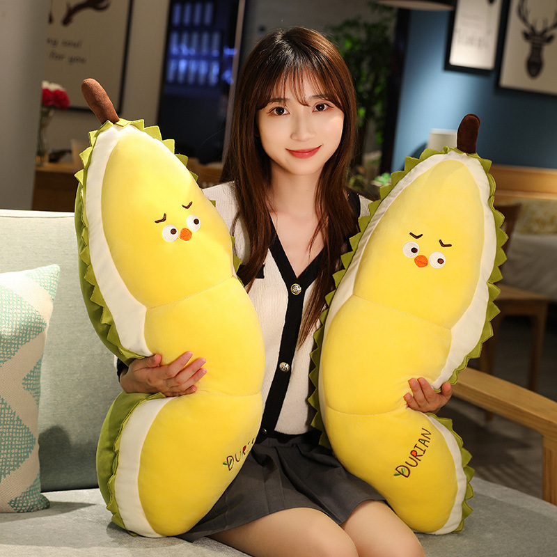 Durian Chick Plush Pillows displayed on a sofa, showcasing their soft plush fabric, playful chick faces, and cozy companion appeal