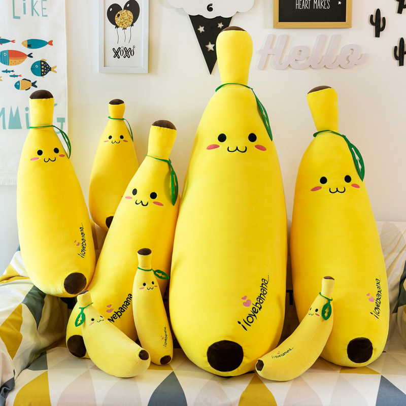 Banana Plush Pillow shown in multiple sizes, highlighting the available size options and playful banana design