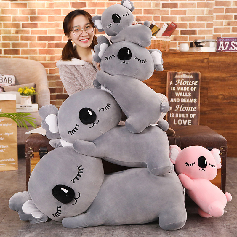 Koala Plush Pillow displayed in multiple sizes, showcasing the sleeping koala design and soft plush texture