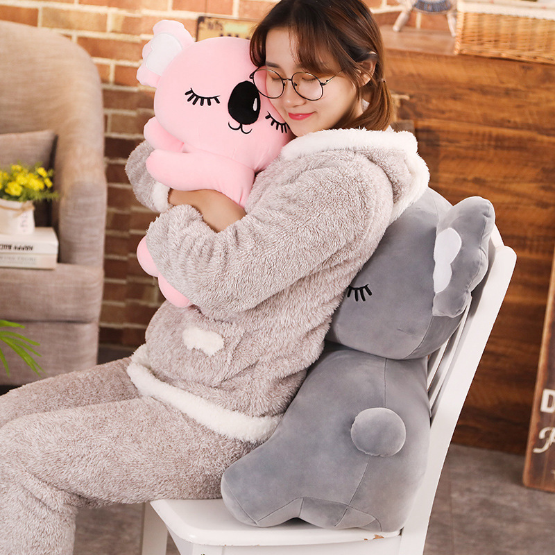 Koala Plush Pillow used as a cozy cushion on a chair, adding comfort and charm to a relaxing space