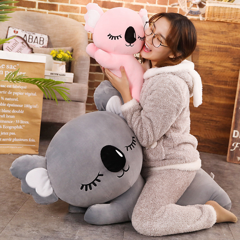 Pink and Gray Koala Plush Pillows showcasing their cute sleeping koala design and soft companion comfort
