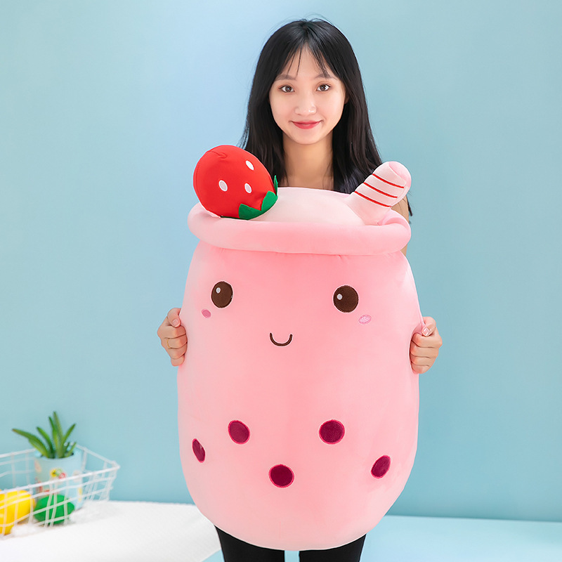 Pink ice cream bubble tea plush pillow featuring embroidered boba pearls, strawberry-inspired accents, and a cheerful cup-shaped design