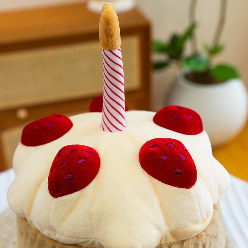 Birthday Cake Plush Toy close-up highlighting embroidered strawberry toppings, striped candle detail, and soft plush frosting design