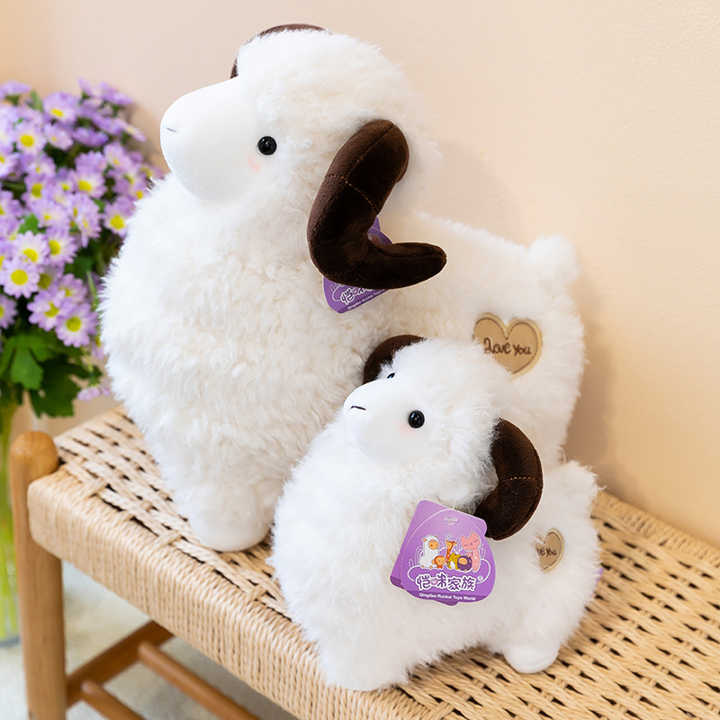 White Bighorn Sheep Plush Toys with fluffy wool-like texture displayed on a woven bench
