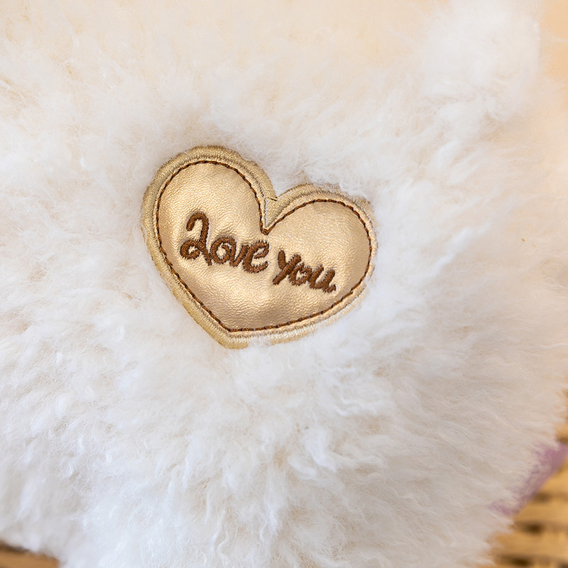 Close-up of Love You heart patch on White Bighorn Sheep Plush Toy