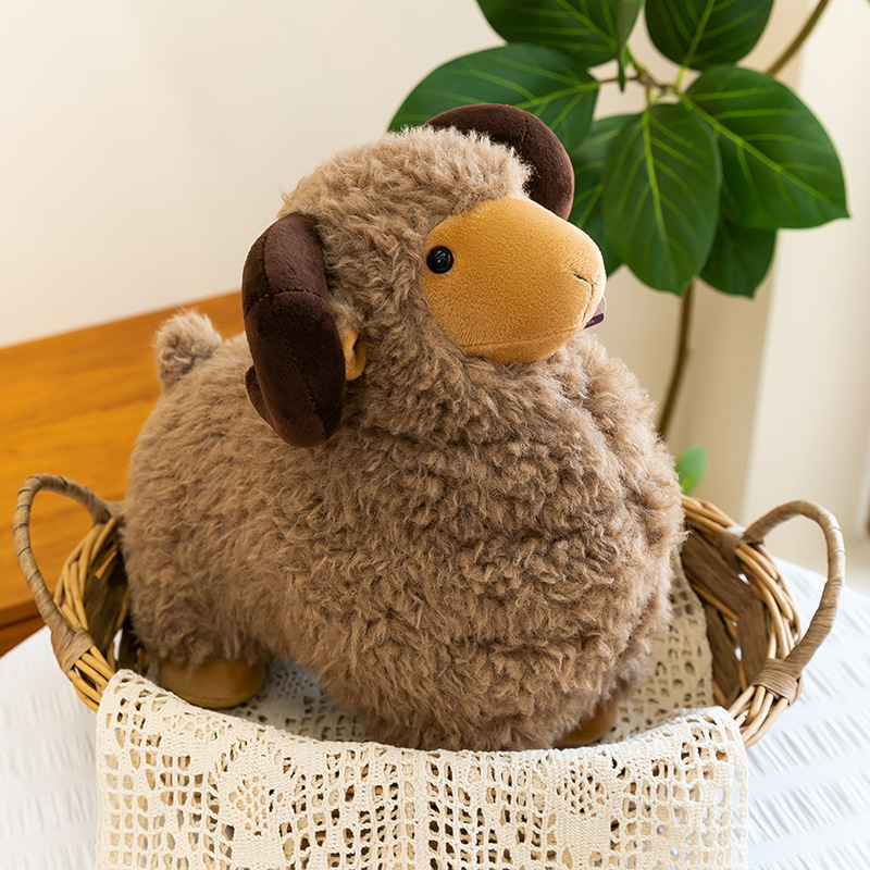 Brown Bighorn Sheep Plush Toy with soft plush fabric and curved horns displayed in a woven basket