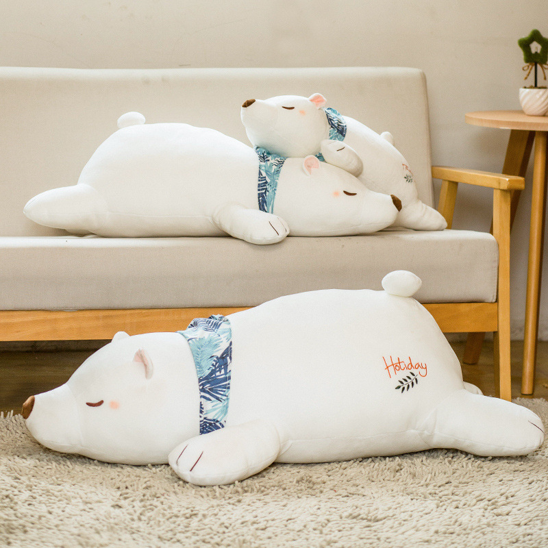 Polar Bear Plush Pillows in multiple sizes displayed on a sofa and rug, creating a warm and cozy living room atmosphere