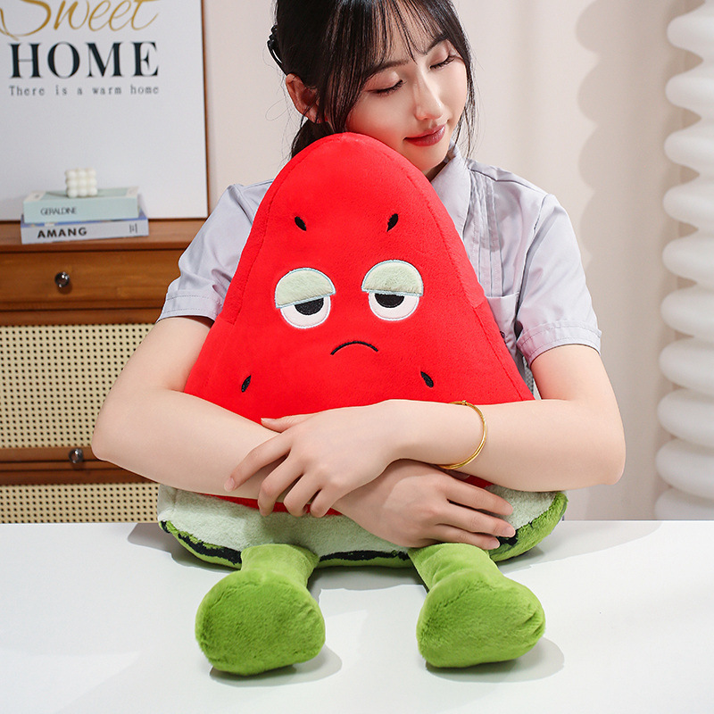 Funny Watermelon Plush Pillow featuring soft plush fabric, fluffy PP cotton filling, and dangling legs, ideal for cuddling, relaxing, and decorative display