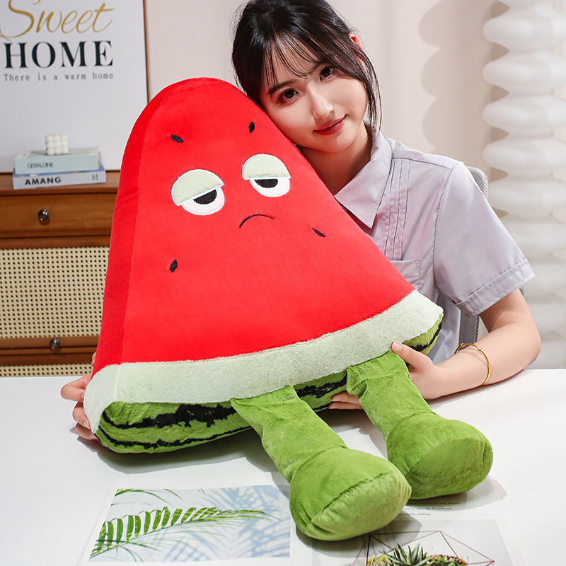 Funny Watermelon Plush Pillow with a quirky sleepy-eyed expression and dangling legs, designed for hugging, lounging, and adding personality to living spaces