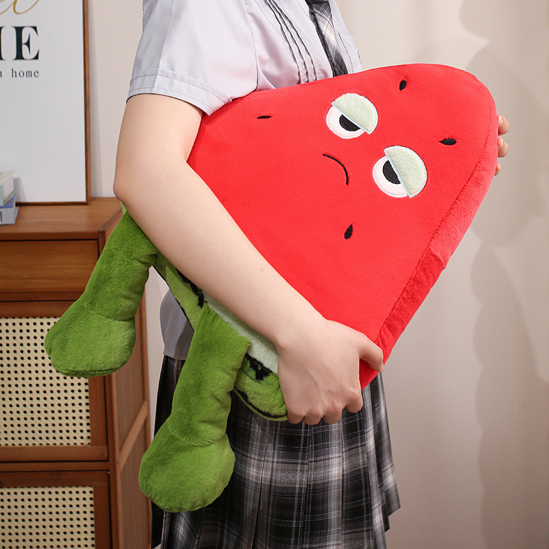 Funny Watermelon Plush Pillow with a sleepy-eyed expression, soft plush fabric, and dangling legs, designed for hugging, carrying, and playful room decor