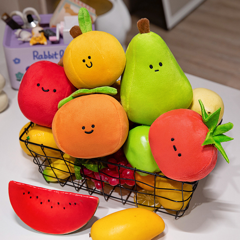 Cute Fruit Plush Toys displayed in a fruit basket featuring apple, pear, orange, persimmon, and tomato designs with soft plush textures and embroidered faces