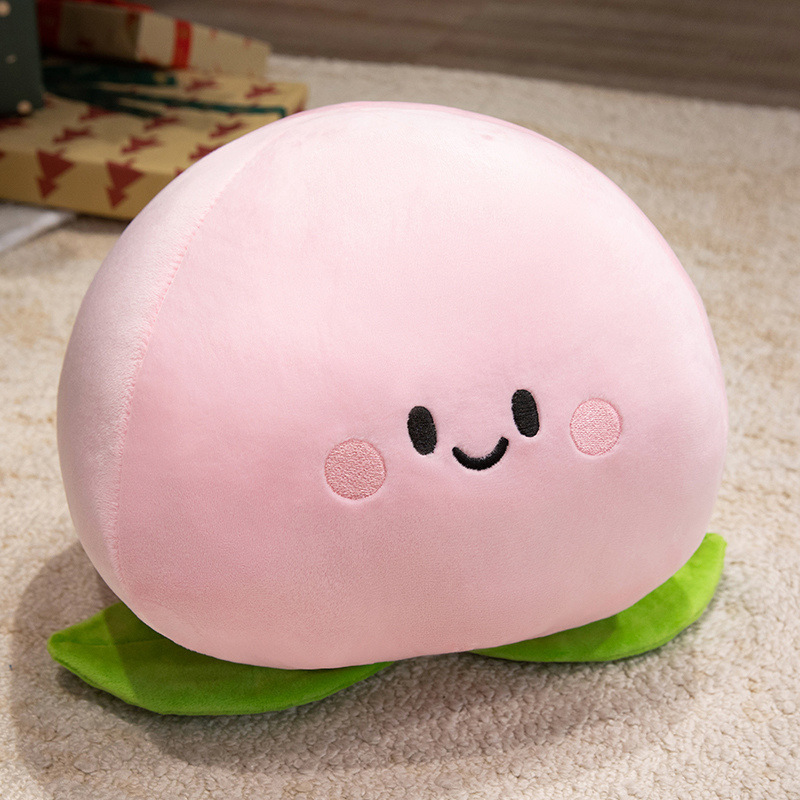Peach Plush Toy featuring embroidered facial details, rosy cheeks, soft plush fabric, and a cute peach-inspired design