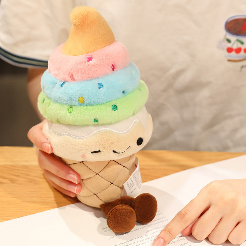 Rainbow Ice Cream Plush Toy with rainbow-colored layers, soft plush fabric, and dangling legs, adding a cheerful touch to desks and workspaces